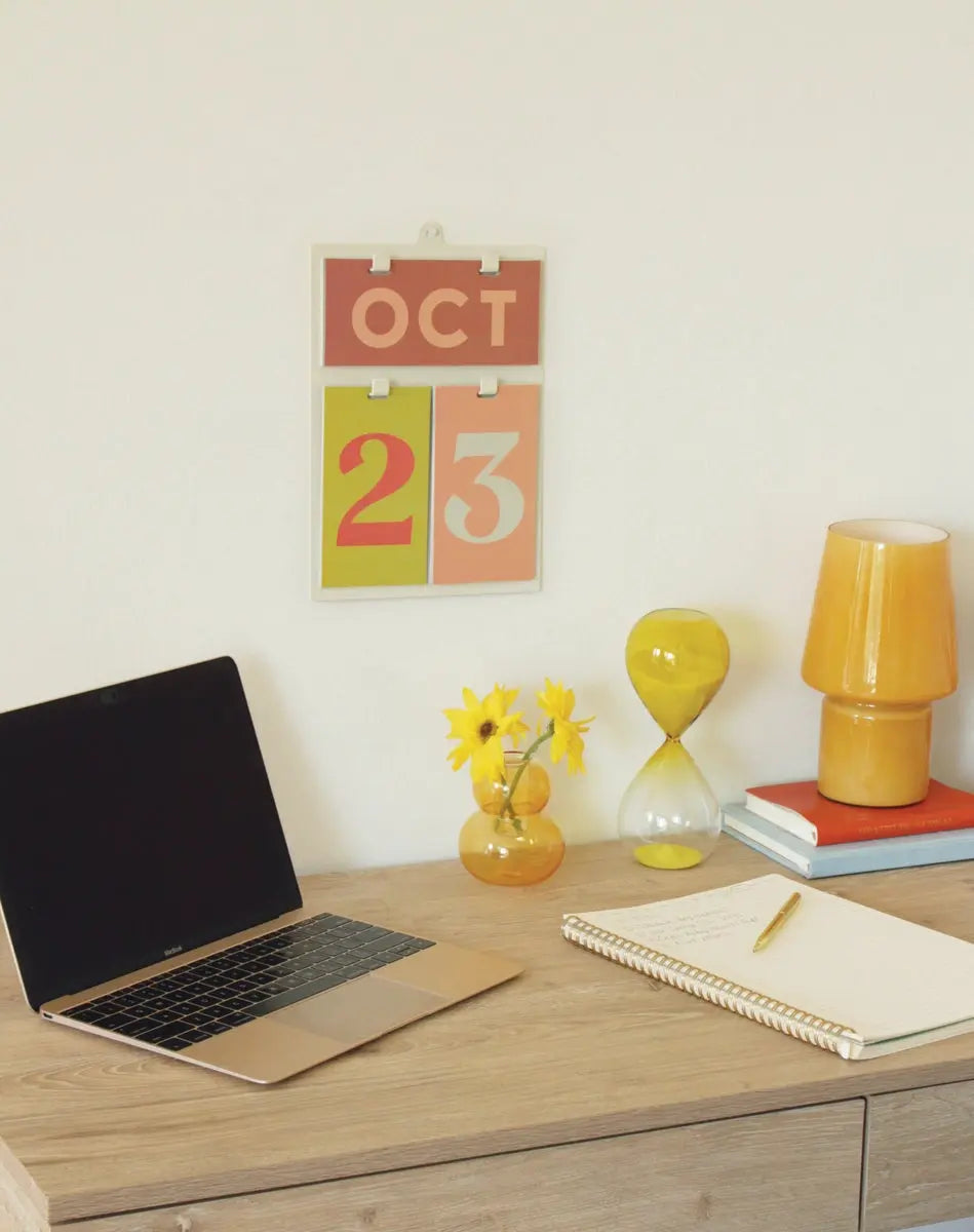 Calendar and notebook on a desk.