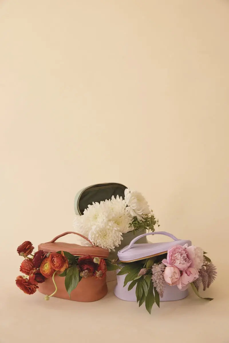 Flowers in colorful carrying cases.