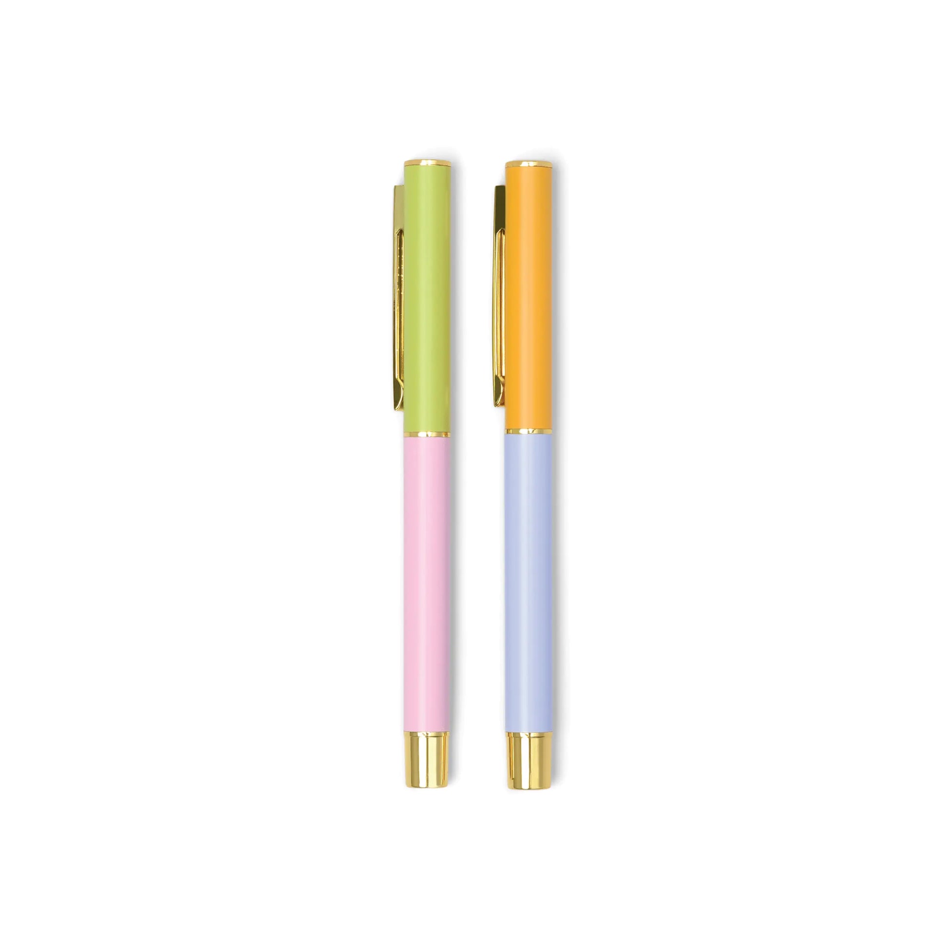Two Color Block Pens - Set of 2 - Lilac + Cornflower, with gold clips and accents, stand upright on a white background, highlighting their vibrant lilac and cornflower hues.