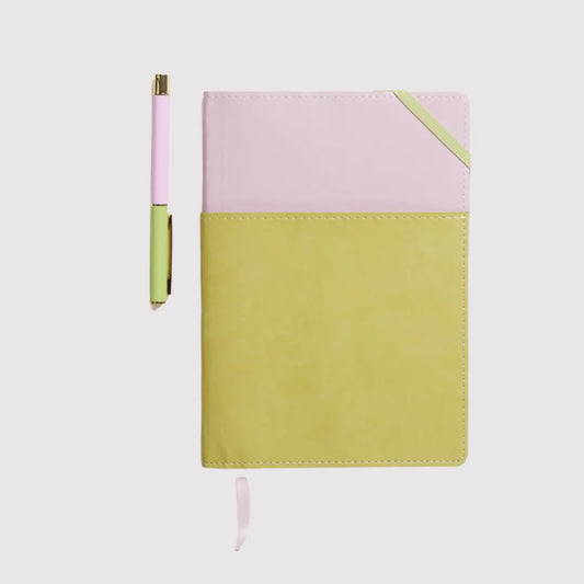 A closed Journal + Pen Bundle (Lilac) featuring a lilac vegan leather cover and matching pen to the left, crafted from eco-friendly materials, displayed on a white background.