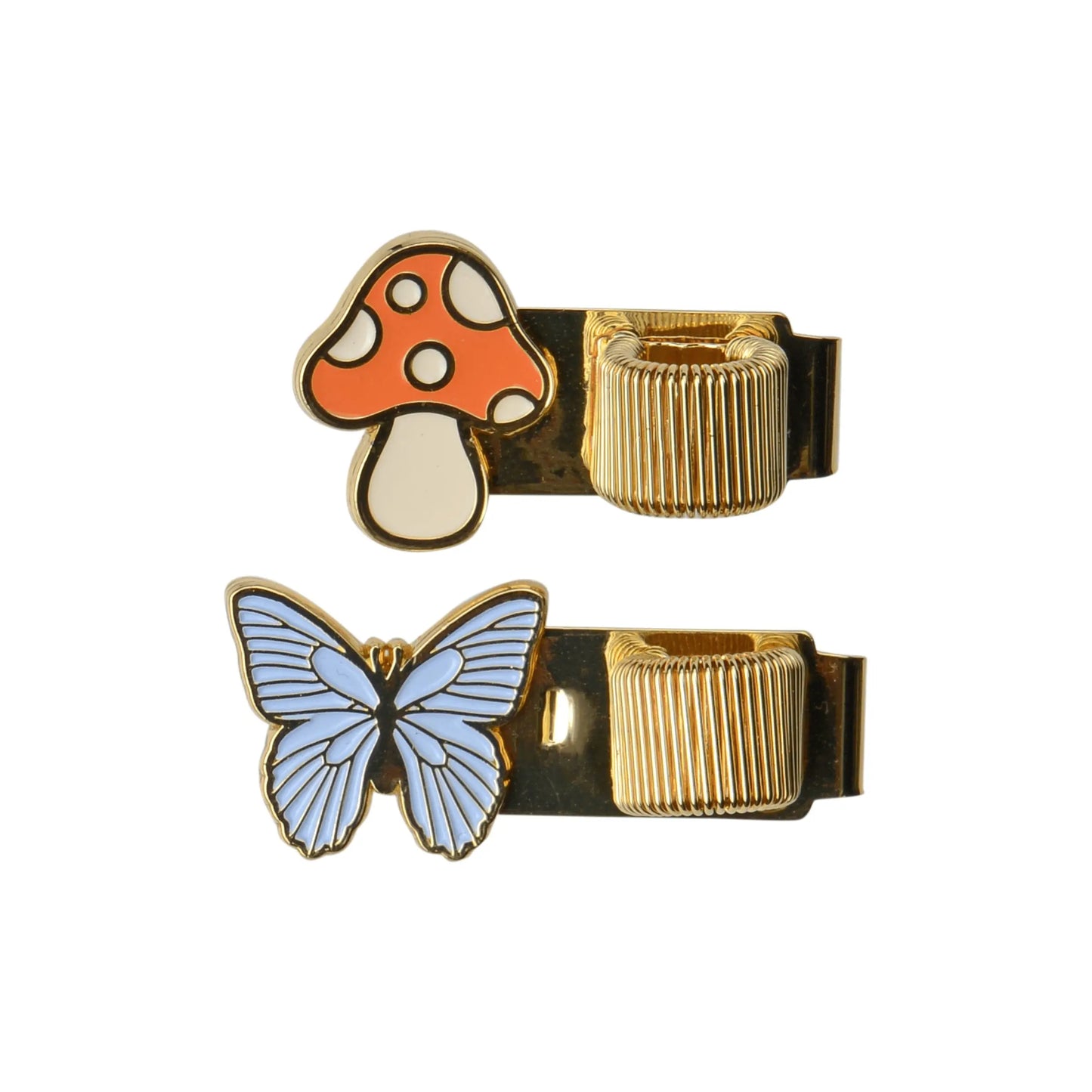 The Set of 2 Pen Clips – Butterfly & Mushroom features gold-toned clips with enamel icons: a red and white mushroom and a blue butterfly. Perfect for adding whimsical charm to your notes, journals, or as pen clips. Shown on a white background.