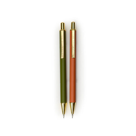 Two Mechanical Pencils - Green + Chili, with gold accents and 0.7mm lead for smooth writing, are shown side by side on a white background.