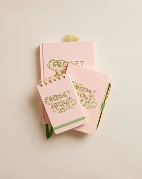 Three Vintage Sass Notepad - Froget about it, in pink with gold frog designs and “FROGET ABOUT IT” text, are stacked—one has twin wire binding, another includes a pen; all use acid-free paper for lasting notes.