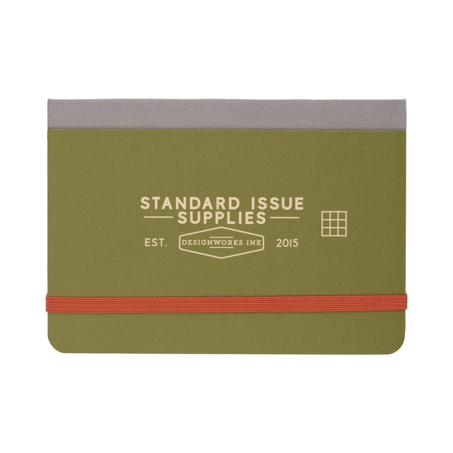 The Standard Issue Pocket Journal - Army Green + Chili is a compact green and gray notebook with Standard Issue Supplies and Designworks Ink on the cover, an orange elastic band, and a convenient grid format.