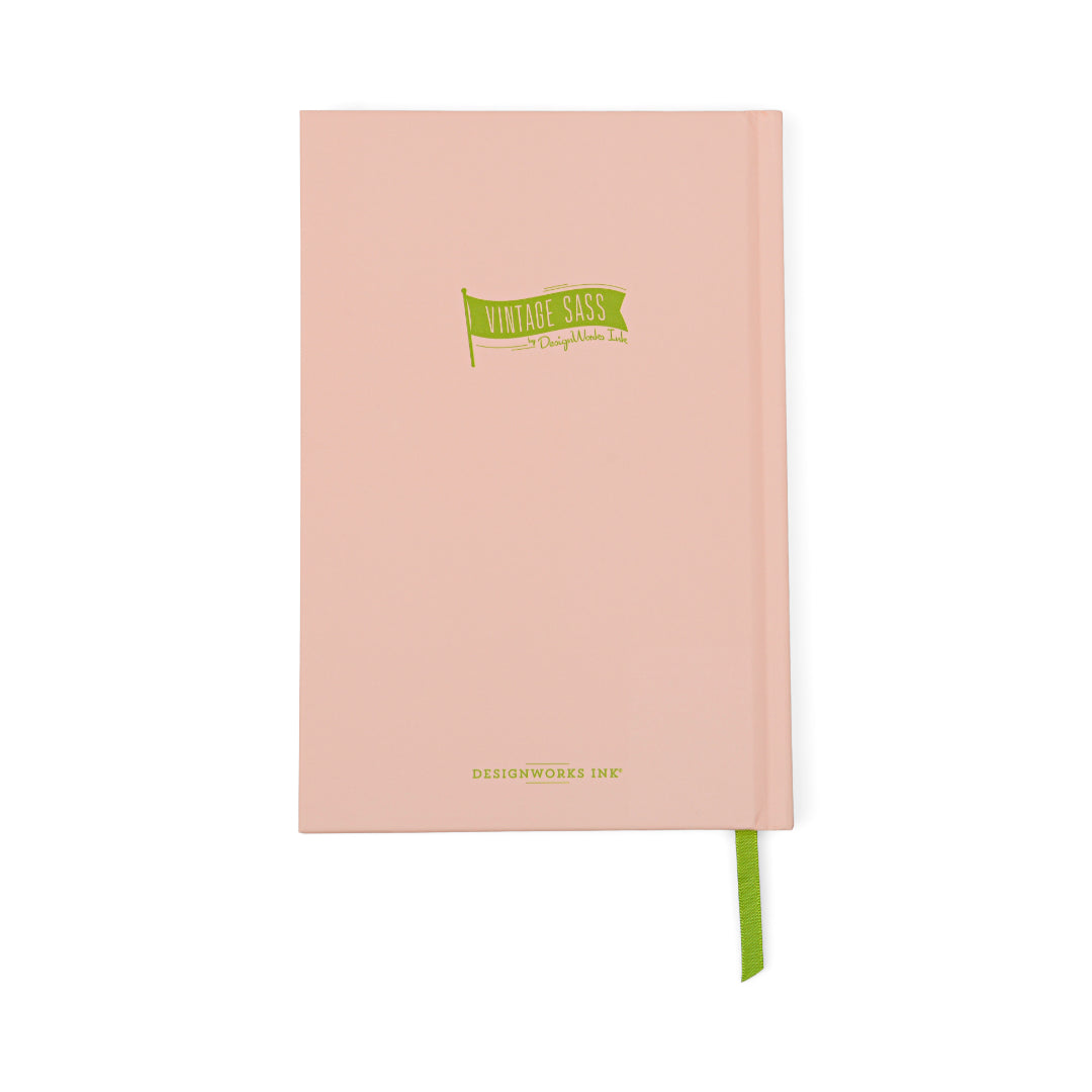Here’s a revised sentence using your product data: The Vintage Sass Journal - Froget About It is a pink lined paper notebook with a green ribbon bookmark, featuring a playful green flag graphic on the cover that reads “Vintage Sass” and the elegant DesignWorks Inc. logo in gold at the bottom.