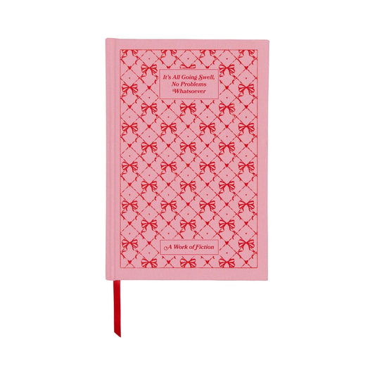The It’s All Going Swell Journal - 5.75x8.5 is a pink hardcover with vintage-inspired bookcloth, red bow pattern, red ribbon bookmark, and “Its All Going Swell, No Problems #vibescore; A Work of Fiction” on the cover.