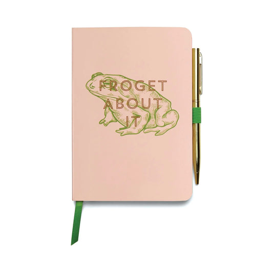The Vintage Sass Notebook with Pen - Froget about it features a pink cover with a green frog and playful text, plus a gold pen held by a green elastic—perfect for creative notes or as a charming, unique gift.