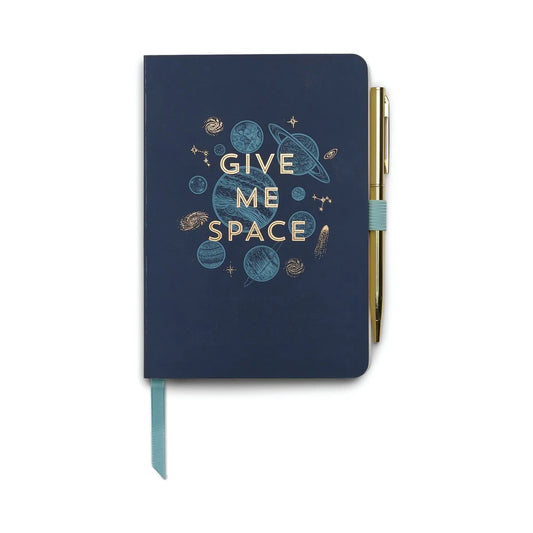 The Vintage Sass Notebook with Pen - Give Me Space features a navy blue cover with a gold and blue intergalactic design and the words GIVE ME SPACE. Comes with an attached gold pen—perfect for capturing your thoughts and creativity.