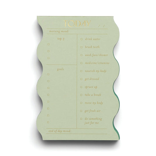 The Wavy Daily Notepad - Sage features a green wavy-edged design with sections for morning mood, daily goals, top 3 tasks, end of day mood, and a self-care checklist.