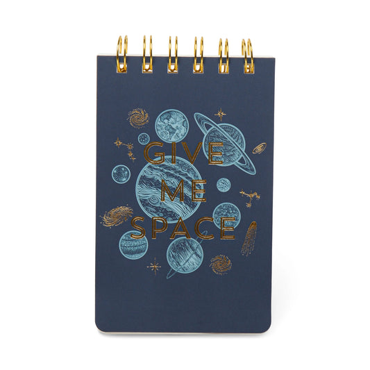 The Vintage Sass Notepad - Give me Space features a navy blue cover with gold and blue planets and stars, accented by a space-themed design and the phrase GIVE ME SPACE on the front.
