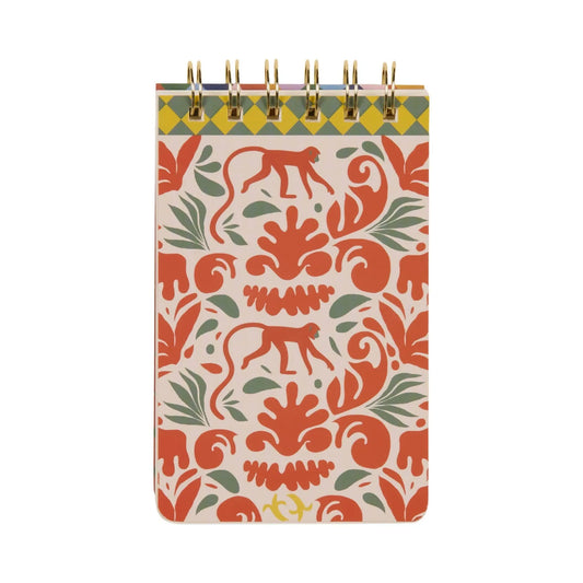The A Dopo Monkey Twin Wire Notepad features hand-drawn orange and green monkeys with foliage motifs on a light cover, bringing Mediterranean travel vibes to a compact spiral-bound notebook.