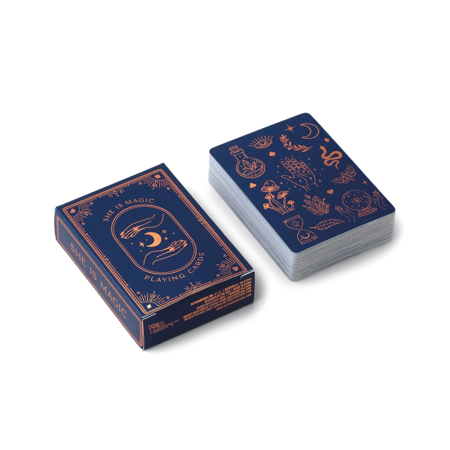 The Playing Cards - She Is Magic deck features mystical gold foil illustrations on a dark blue background, shown beside its matching box.