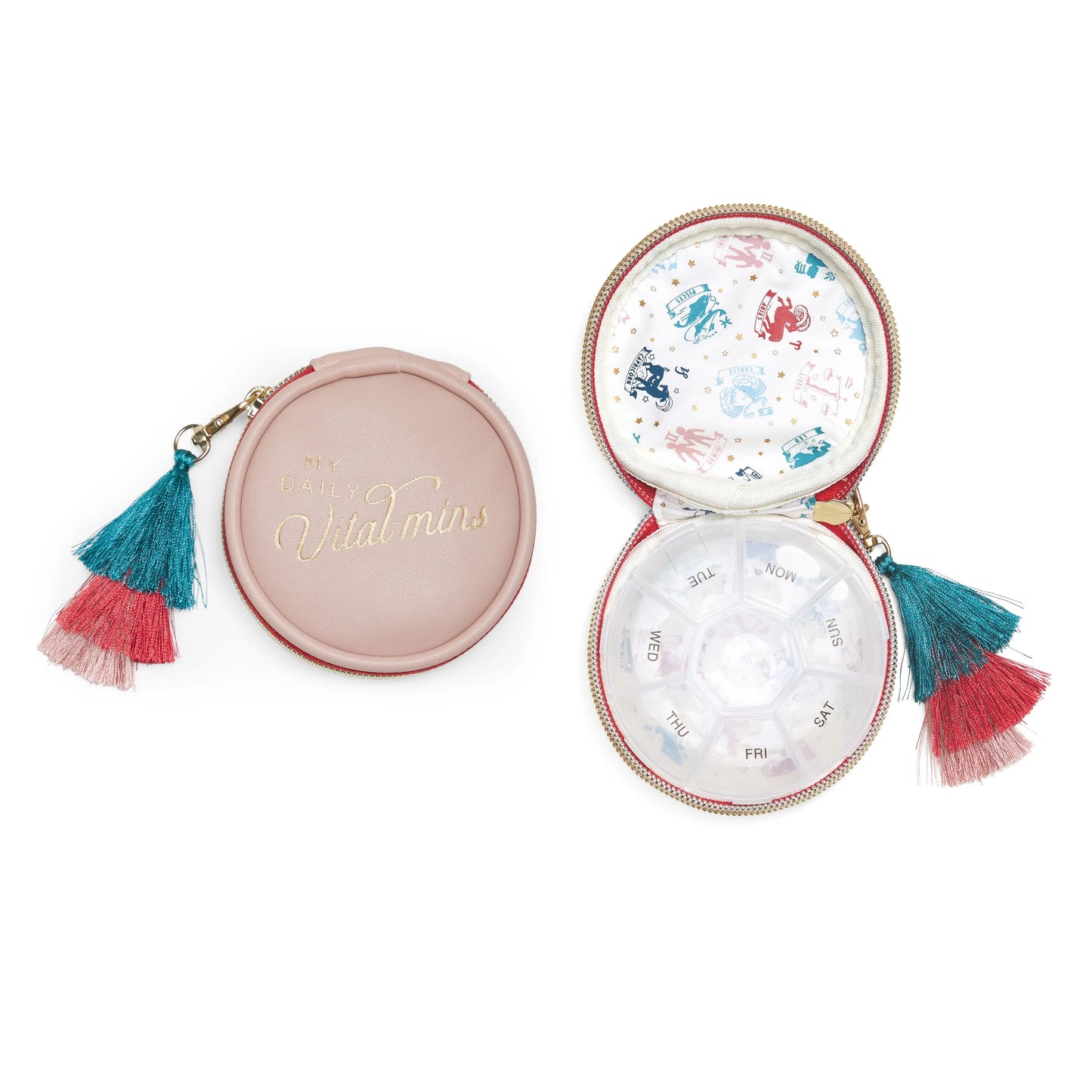 A round pink Vegan Leather Travel Pill Case with a colorful tassel keychain, labeled Daily Vital-Mins, features a weekly pill organizer inside for each day of the week.