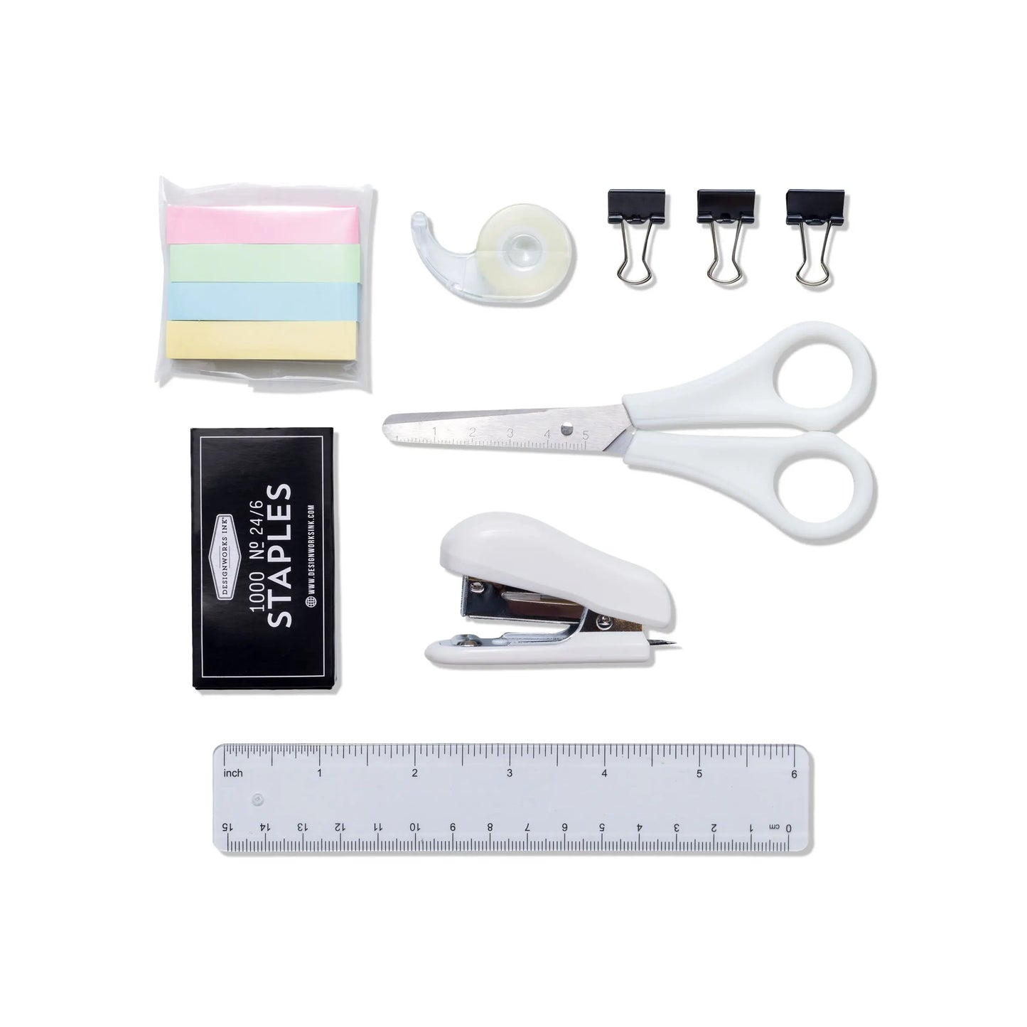 The Office On The Go - Matcha + Forest kit includes sticky notes, tape, binder clips, scissors, staples, a stapler, and a transparent ruler—all organized neatly on a white background.