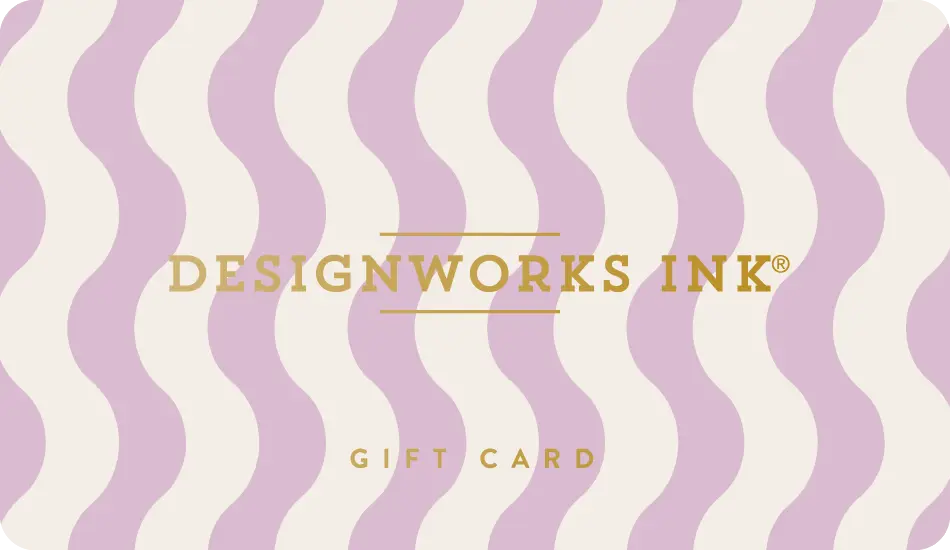 The Designworks Ink E-Gift Card features a wavy lavender and cream background with DESIGNWORKS INK® and GIFT CARD in gold lettering.