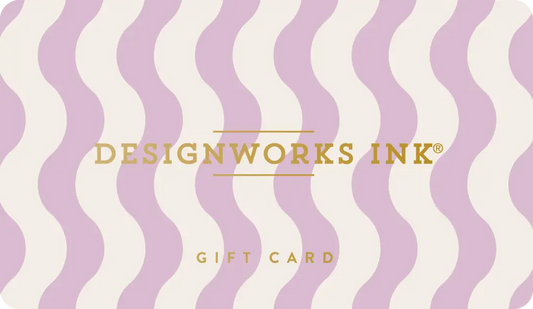 The Designworks Ink E-Gift Card features a wavy lavender and cream background with DESIGNWORKS INK® and GIFT CARD in gold lettering.