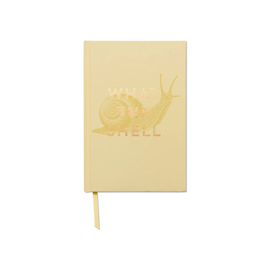 The Vintage Sass Journal - What The Shell features a pale yellow cover with a gold-embossed snail and the phrase WHAT THE SHELL, plus a matching yellow ribbon bookmark.