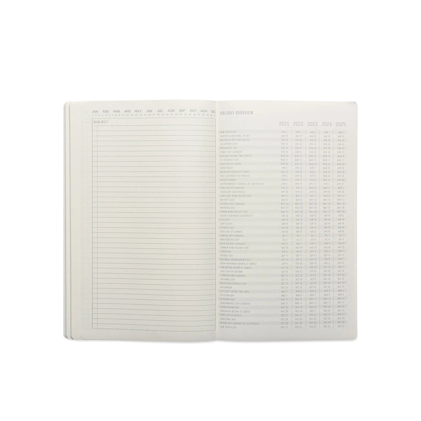 The Standard Issue Tall Notebook No.17 - Blue opens to a lined notes page on the left and a multi-year holiday overview table on the right, delivering the premium writing experience of Standard Issue notebooks.