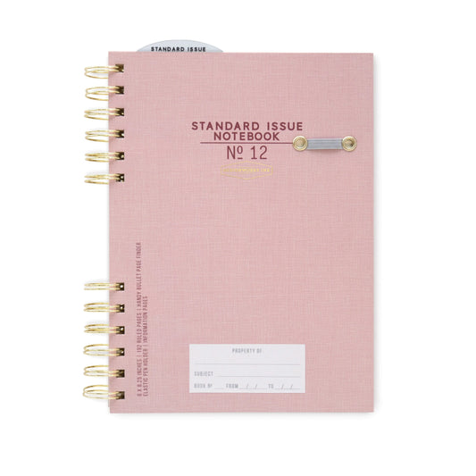 The Standard Issue Notebook No.12 - Dusty Pink is a spiral-bound notebook with high-quality construction, a button closure, and a white label for subject and date.