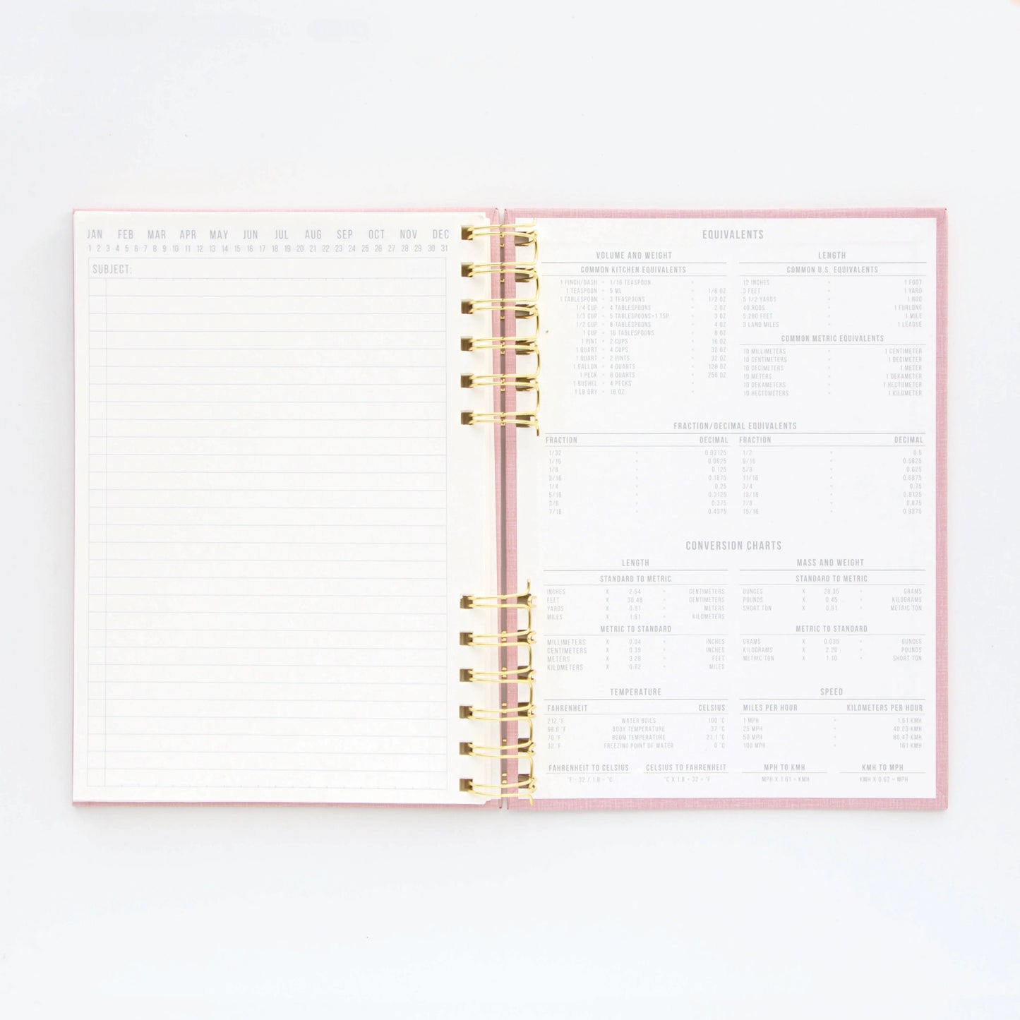 The Standard Issue Notebook No.12 - Dusty Pink is an open spiral-bound notebook with a blank lined page on the left, measurement conversion charts on the right, and high-quality construction for a premium writing experience.