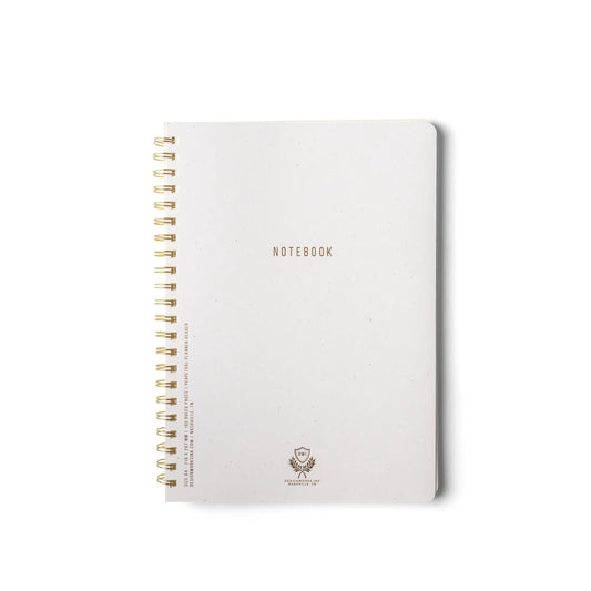 A large Textured Paper Twin Wire Notebook in speckled ivory with a softcover and gold NOTEBOOK lettering is displayed on a plain white background.