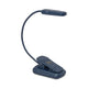 The Book Light - Navy features a lightweight design, flexible neck, and rectangular lamp head. Clipped upright, it’s the ideal travel companion for reading on the go.