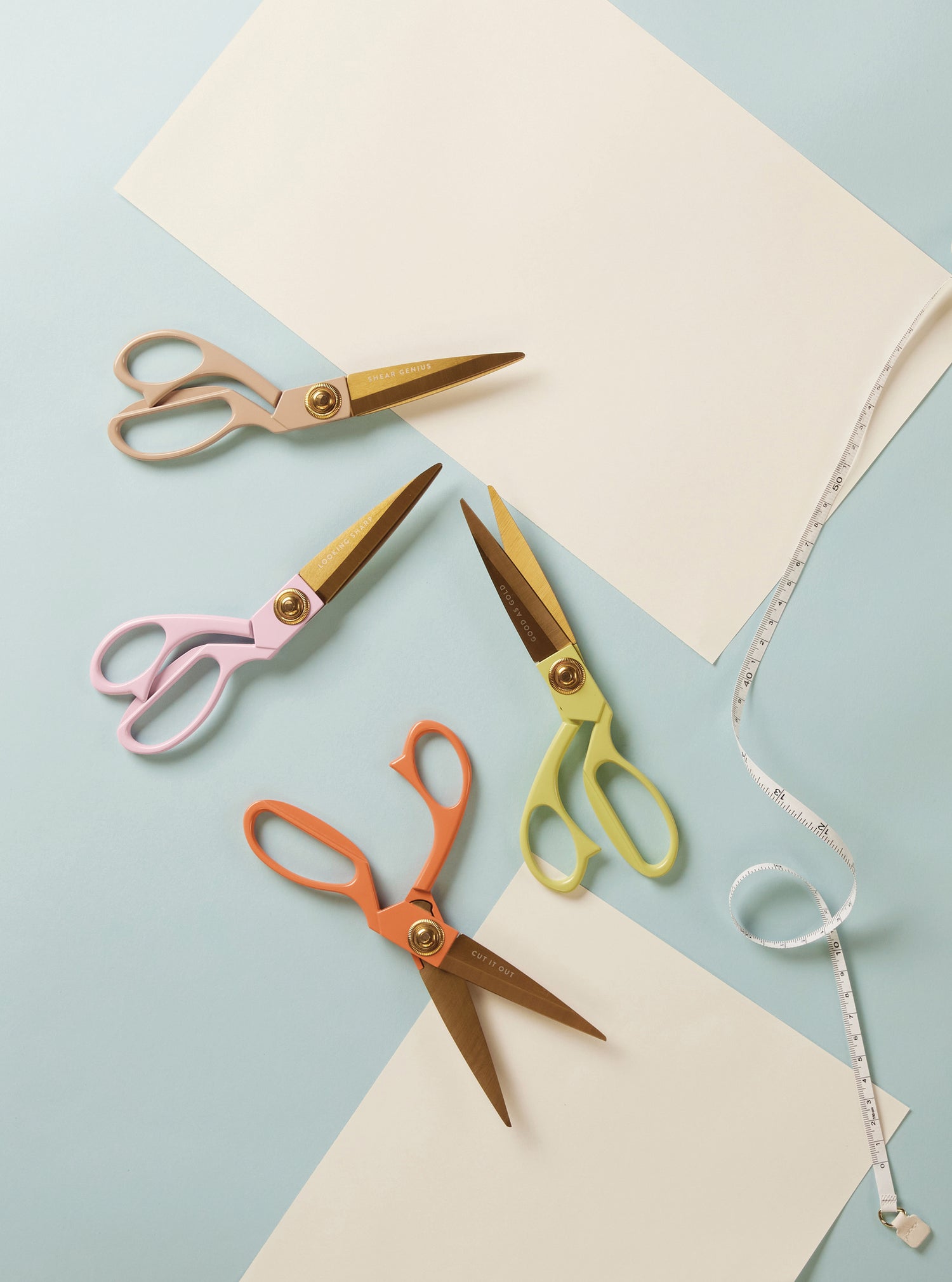 Scissors and paper on a pale background