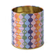 The A Dopo Eye Storage Tin from the Whimsical Collection features a wavy, multicolored design with stylized eyes and a gold interior—ideal for storing treasures or adding flair to your storage tins.