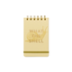 The Vintage Sass Notepad - What The Shell is a small yellow spiral-bound notebook with a snail illustration and "WHAT THE SHELL" embossed in gold foil on the cover, plus an elastic band at the bottom.