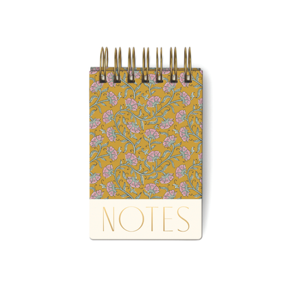 The Chunky Notepad - Gold Vintage Floral is a small hard-cover pocket notepad with a yellow, pink, and green floral design and "NOTES" in gold letters at the bottom. It contains 192 sheets for all your writing needs.