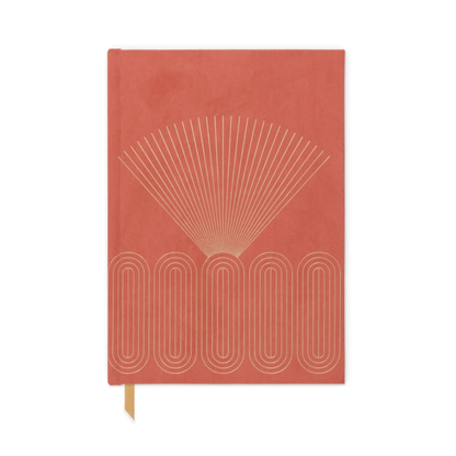 The Radiant Journal - Rays features a coral hardcover with gold geometric rays and oval accents, plus a yellow ribbon bookmark.