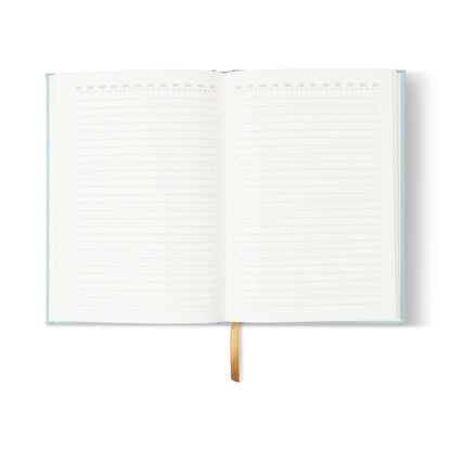 The Hard Cover Suede Cloth Journal With Pocket - Arch Dot features a blue suede cover, yellow ribbon bookmark, lined pages with top-edge icons, and is displayed open on a white background.