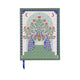 The A Dopo Peacock Journal (6 x 7.75) features a hardcover with two peacocks facing a vase of flowers, green and blue borders, lay-flat binding, and a blue ribbon bookmark.