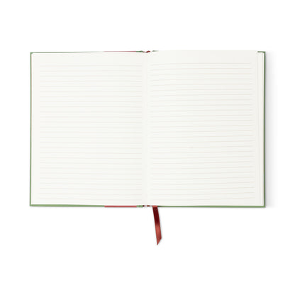The A Dopo Elephant Journal is an open eco-friendly notebook with lined white pages, a green cover, and a red ribbon bookmark, photographed lying flat on a white background.
