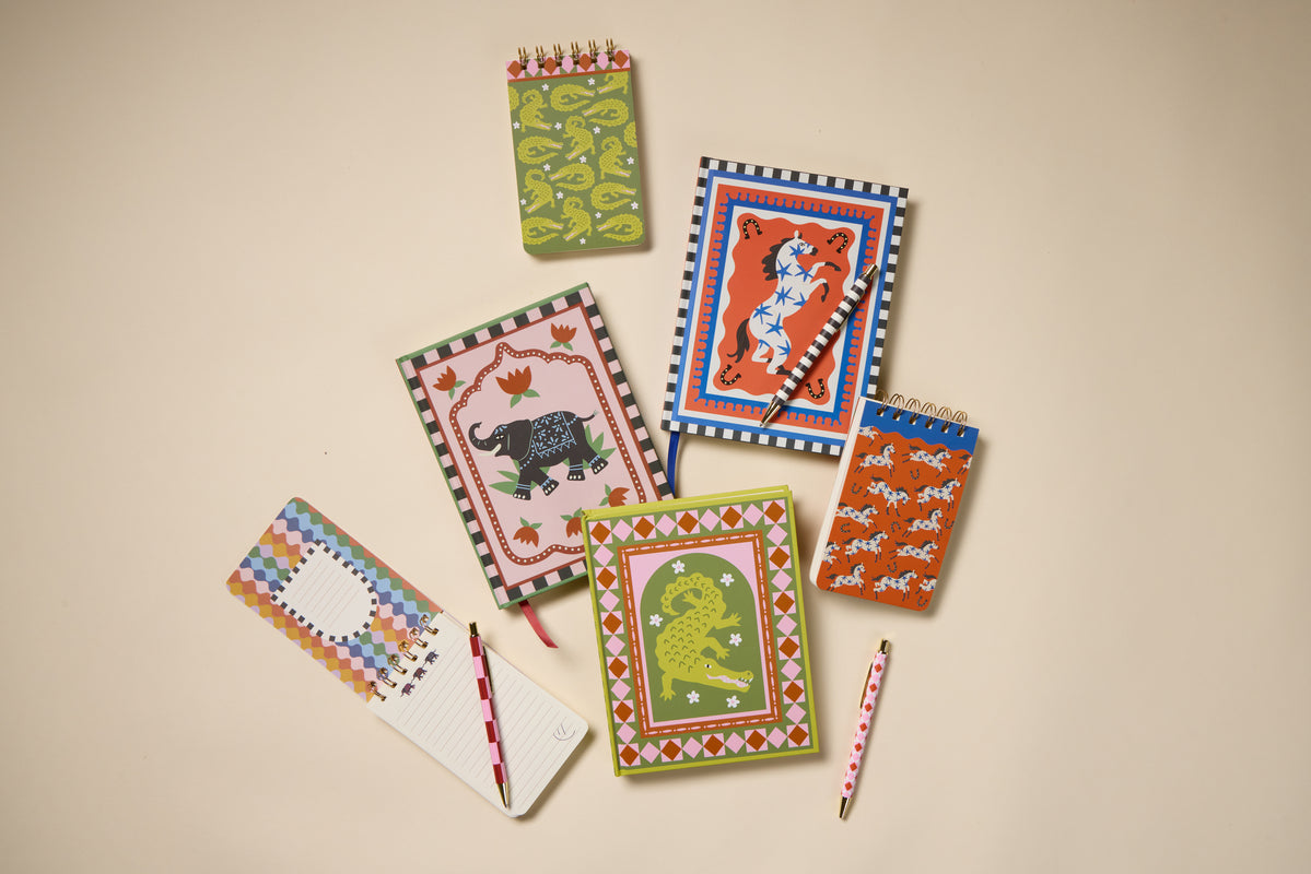 A Dopo Horse Twin Wire Notepad features vibrant Mediterranean-inspired design with playful animal illustrations, such as horses, and compact size, displayed on a beige background.