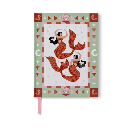 A hardcover notebook featuring a mermaid illustration on the cover, with a pink ribbon bookmark hanging from the bottom edge, set against a plain white background.
