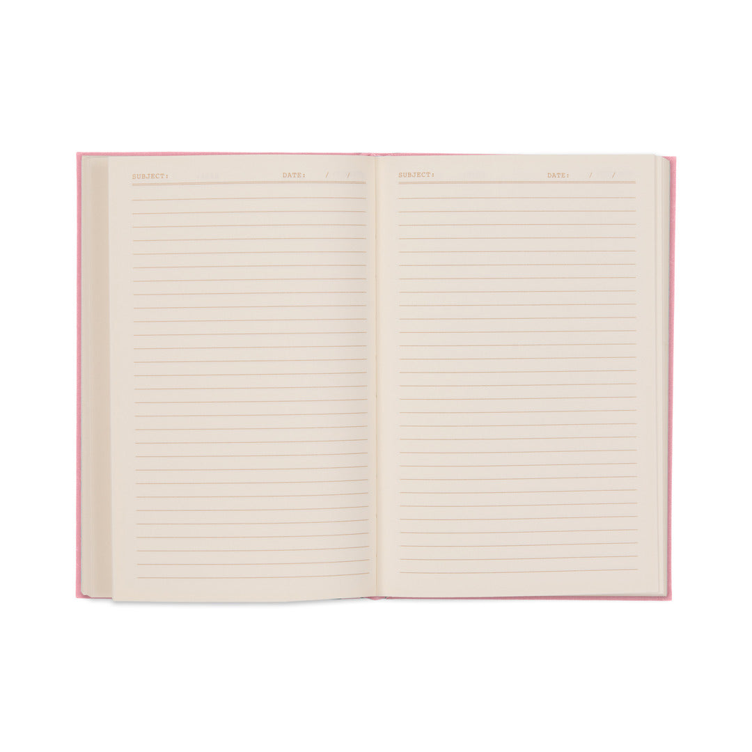 The It’s All Going Swell Journal is pictured open, displaying its blank lined pages with designated sections for Subject and Date at the top. Featuring a pink bookcloth cover and lay-flat binding for easy writing, the journal sits against a white background.