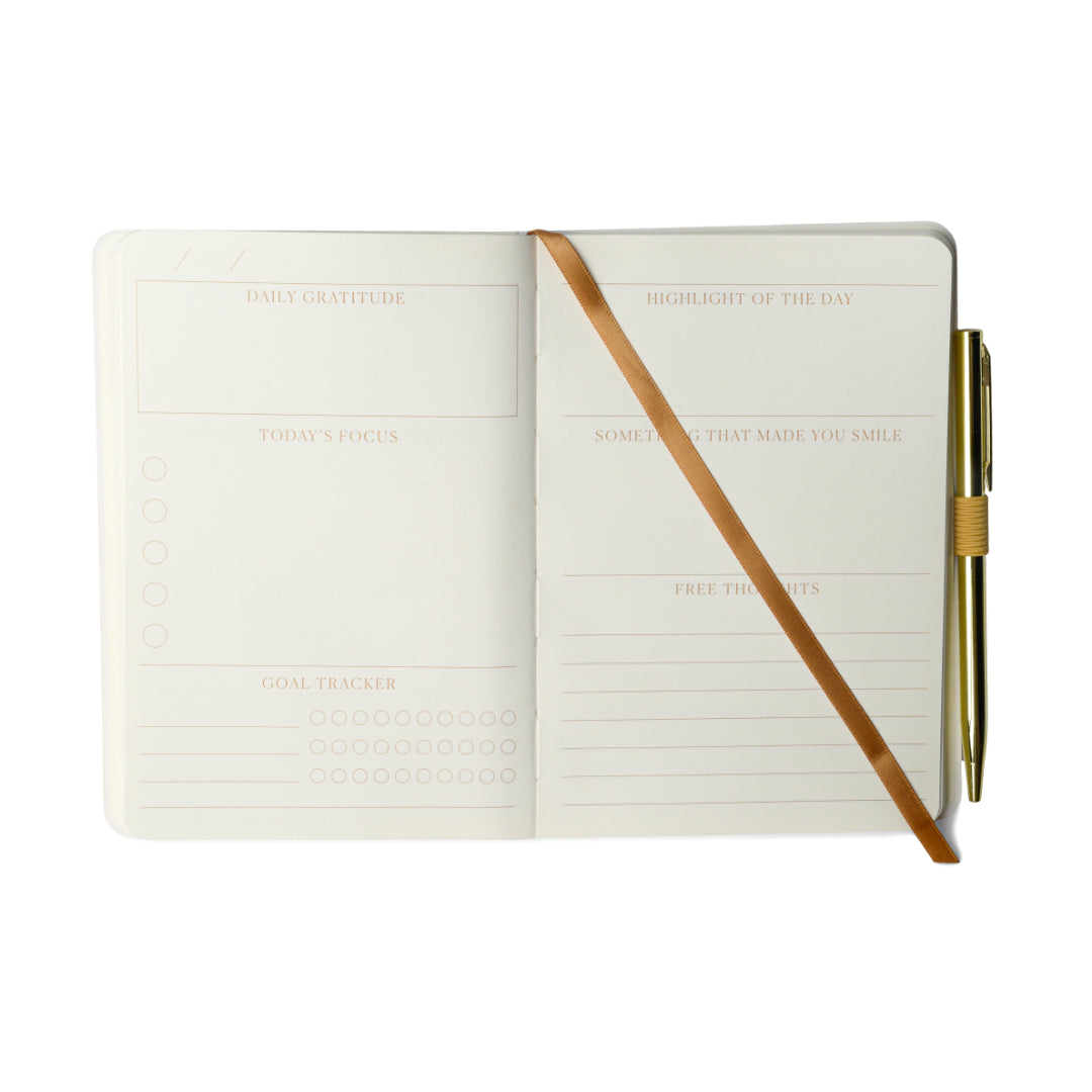 Experience mindful reflection with the Gratitude Journal with Pen – Attitude of Gratitude. This open guided journal features dedicated sections for daily gratitude, highlight of the day, today’s focus, something that made you smile, a goal tracker, and space for free thoughts. It comes complete with an attached gold pen and tan ribbon bookmark. With mostly blank pages, it’s perfect for anyone seeking a customizable mindfulness journal experience.