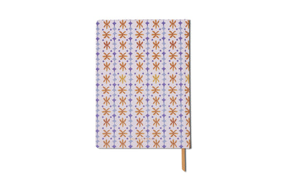 The Tulip Jumbo Journal - Marigold features a slim design with red, yellow, and purple geometric shapes on a white background, a purple striped edge, and a yellow ribbon bookmark.