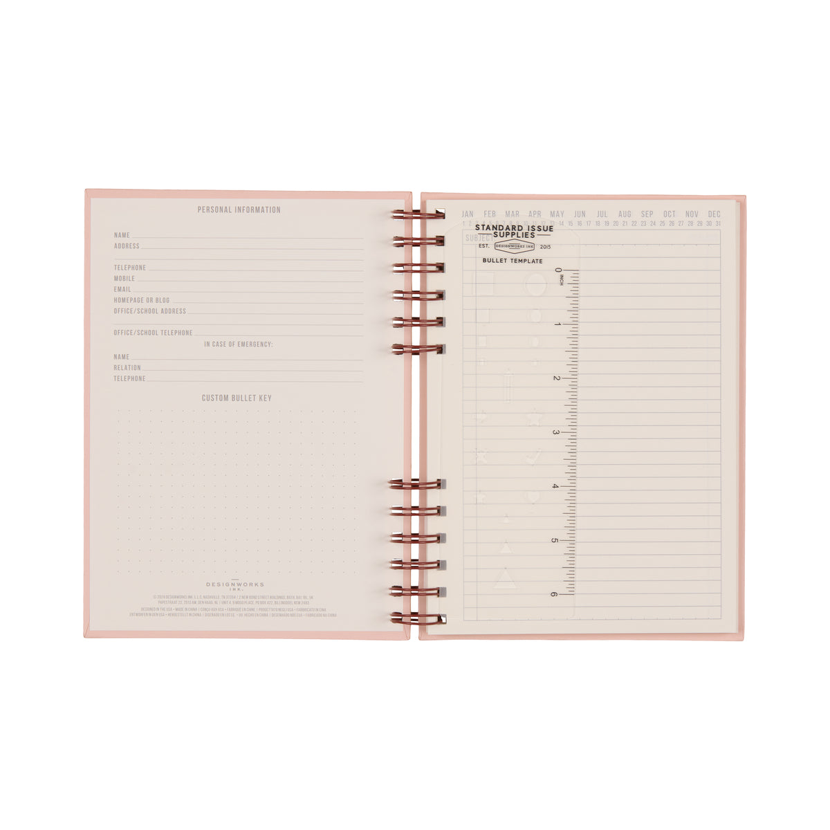 Introducing the Standard Issue Planner Notebook No. 12 - Rosewood + Blush: an open spiral-bound planner featuring a pink cover and a clean, organized layout inspired by the classic Standard Issue Notebook. Includes dedicated pages for personal information, a customizable bullet key, and versatile bullet journal templates such as monthly and date sections alongside dot grid pages—perfect for a premium writing experience.
