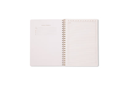 The Tulip Twin Wire Notebook - Large Wavy Blue is open, showing a left page with Personal Information sections and a right lined, perforated page with numbered columns to help organize your notes.