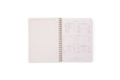 The Tulip Twin Wire Notebook - Large Wavy Blue opens to lined, perforated, numbered sections on the left page, while the right page features printed tables and data in small text.