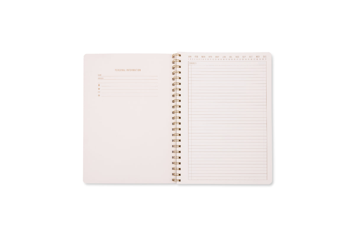 The Tulip Large Twin Wire Notebook - Orange Check features gold twin wire binding. The left page has personal info fields; the right page offers lined, perforated sheets with a monthly calendar strip, similar to an Orange Check Notebook.