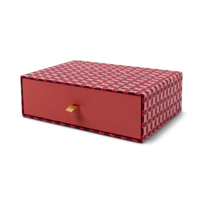 The Boxed Tulip Notecard Set - 16 Cards comes in a rectangular box with a red and pink geometric design, featuring a single drawer with a tan ribbon pull. Ideal for storing notecards and envelopes, it's shown against a white background.