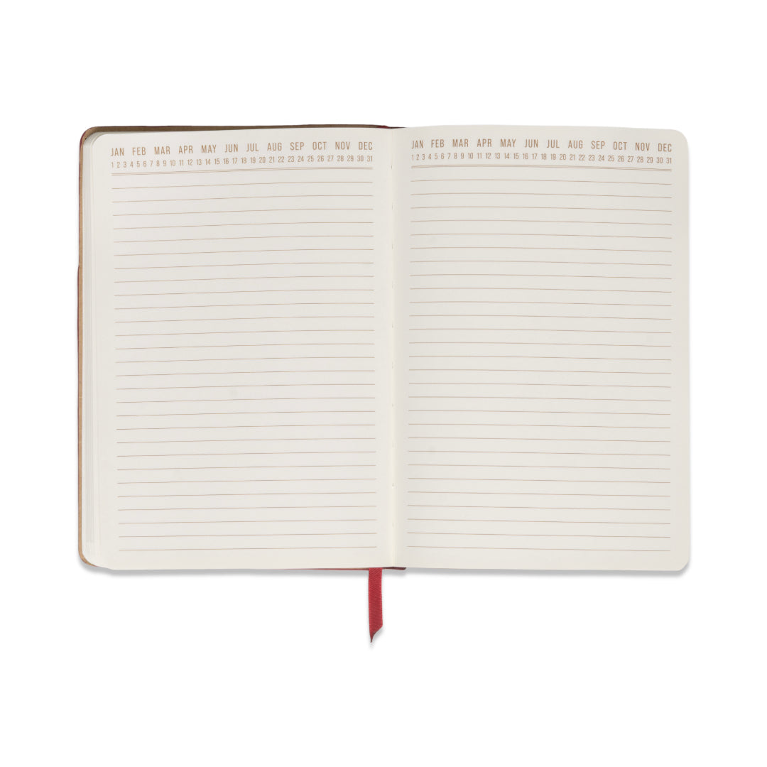 Introducing the Vegan Leather Pocket Journal in Burgundy + Pink—an open colorblock notebook accented with a red ribbon bookmark. Each premium, blank page offers a smooth writing surface and features months from January to December along the top, with days numbered 1 to 31. Perfect for capturing your notes and ideas in style.