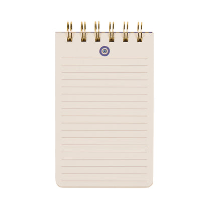 The A Dopo Twin Wire Notepad - Eye is a compact, lined notepad featuring blank pages with subtle, hand-drawn Mediterranean-inspired designs and gold twin wire binding at the top—perfect for jotting down notes or ideas, shown here against a white background.