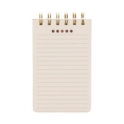 Introducing the A Dopo Twin Wire Notepad - Moon Phases: a compact, spiral-bound notepad inspired by Mediterranean design. It features lined, blank pages on a crisp white background, with elegant gold twin-wire binding at the top and five punched holes just below for added versatility. Perfect for stationery enthusiasts and lovers of hand-drawn motifs, this notepad blends creativity with functional style.