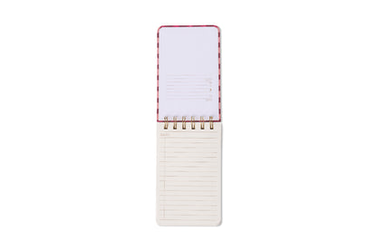 The Tulip Twin Wire Notepad - Pinwheel Pink is open, showing lined pages. The top sheet has spaces for date, number, and subject, while the bottom sheet is simply ruled. All set against a white background.
