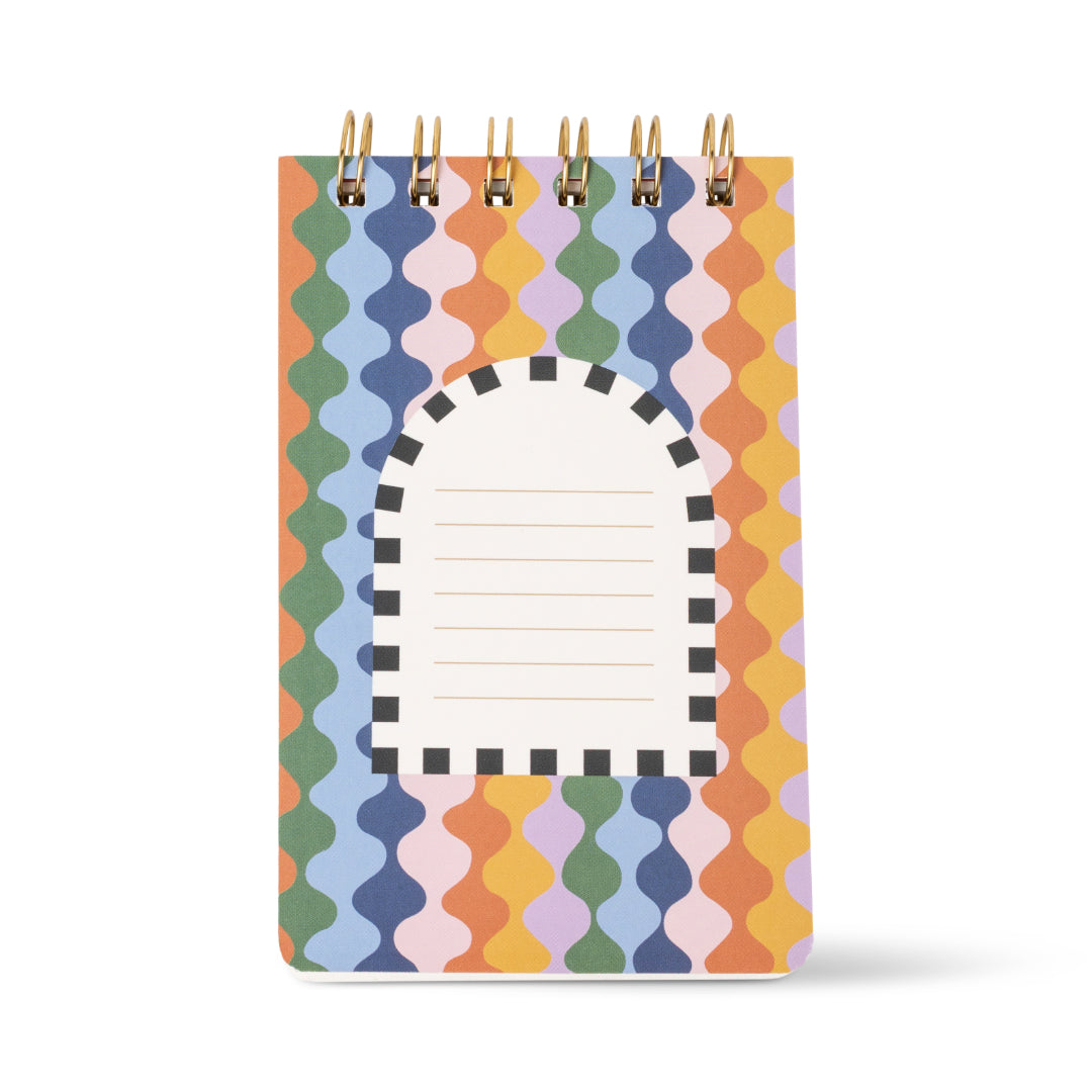 Introducing the A Dopo Twin Wire Notepad - Elephant: a compact, eco-friendly notepad adorned with a vibrant wavy pattern and an arched label accented by black-and-white stripes. With horizontal lined pages for easy writing, it’s perfect for those who love sustainable stationery with bold, colorful flair.