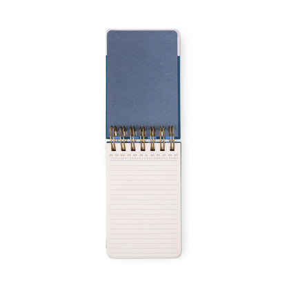 The Chunky Small Twin Wire Notepad - Blue & Navy features a blue cover, lined acid-free pages, and an open spiral-bound design, shown from above on a white background.